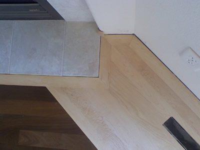 Maple border with Ipe (Brazilian Walnut) laid on the diagonal in the center