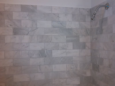 Carrera marble tile walls