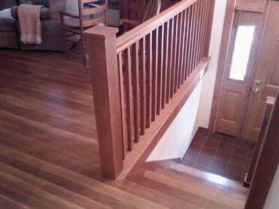 Installed 3 inch, #1 common, long length Quartersawn white oak and matching staircase and railings